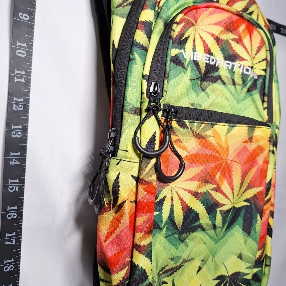 Vibedration Hydration Backpack w/o bladder - green, orange, black leaves - used